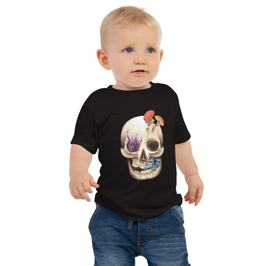 A baby standing wearing a black T shirt featuring a front facing human skull with 3 different kinds of fungi growing out of it