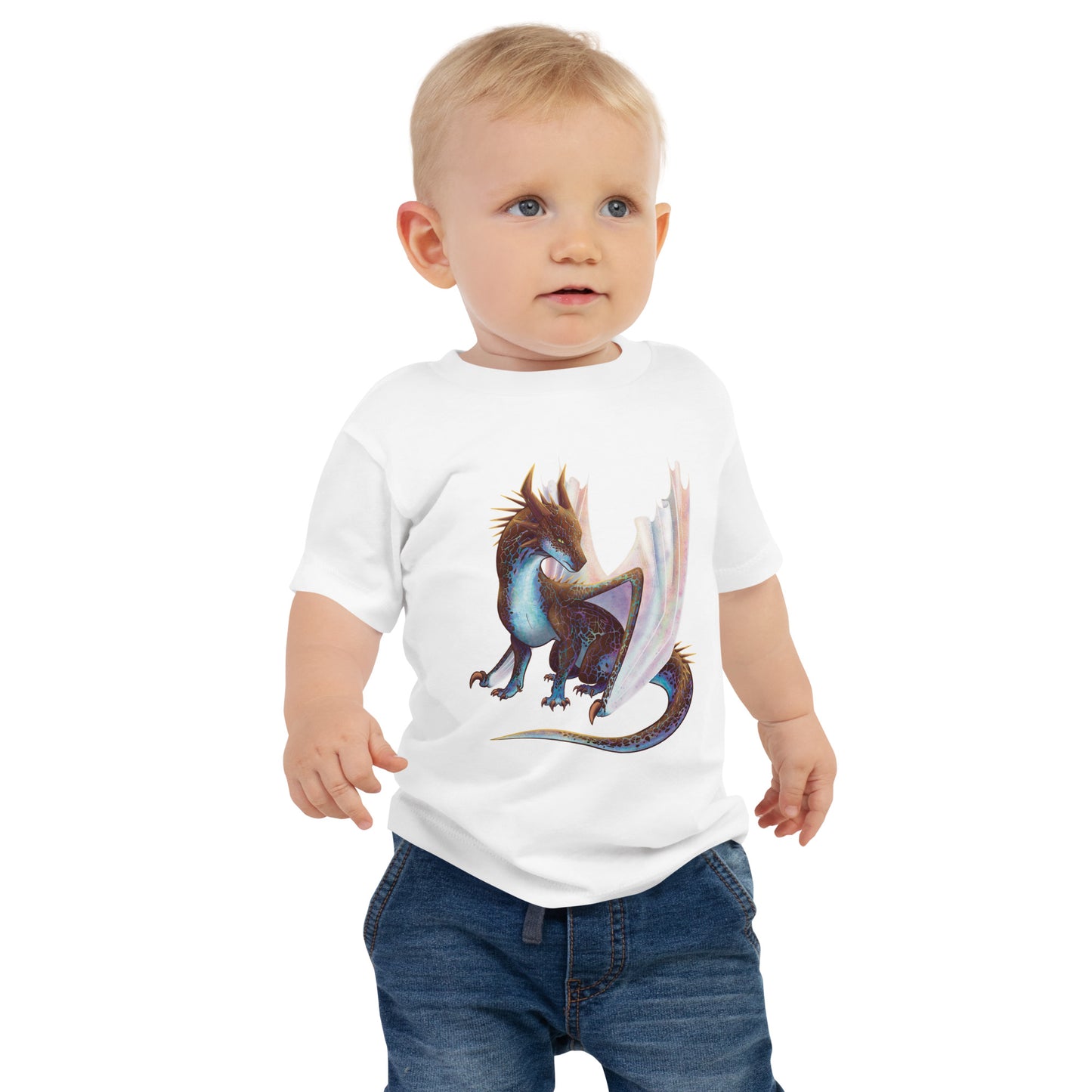 Unisex, white in color baby tee shirt featuring a sitting, side profile of a dragon that has the features of a boulder opal with hues of blue, green, purple, and pink on the underbelly and cracks of the rough, brown hue, rock scales. The wings are tucked back and are of an iridescent shimmery hue