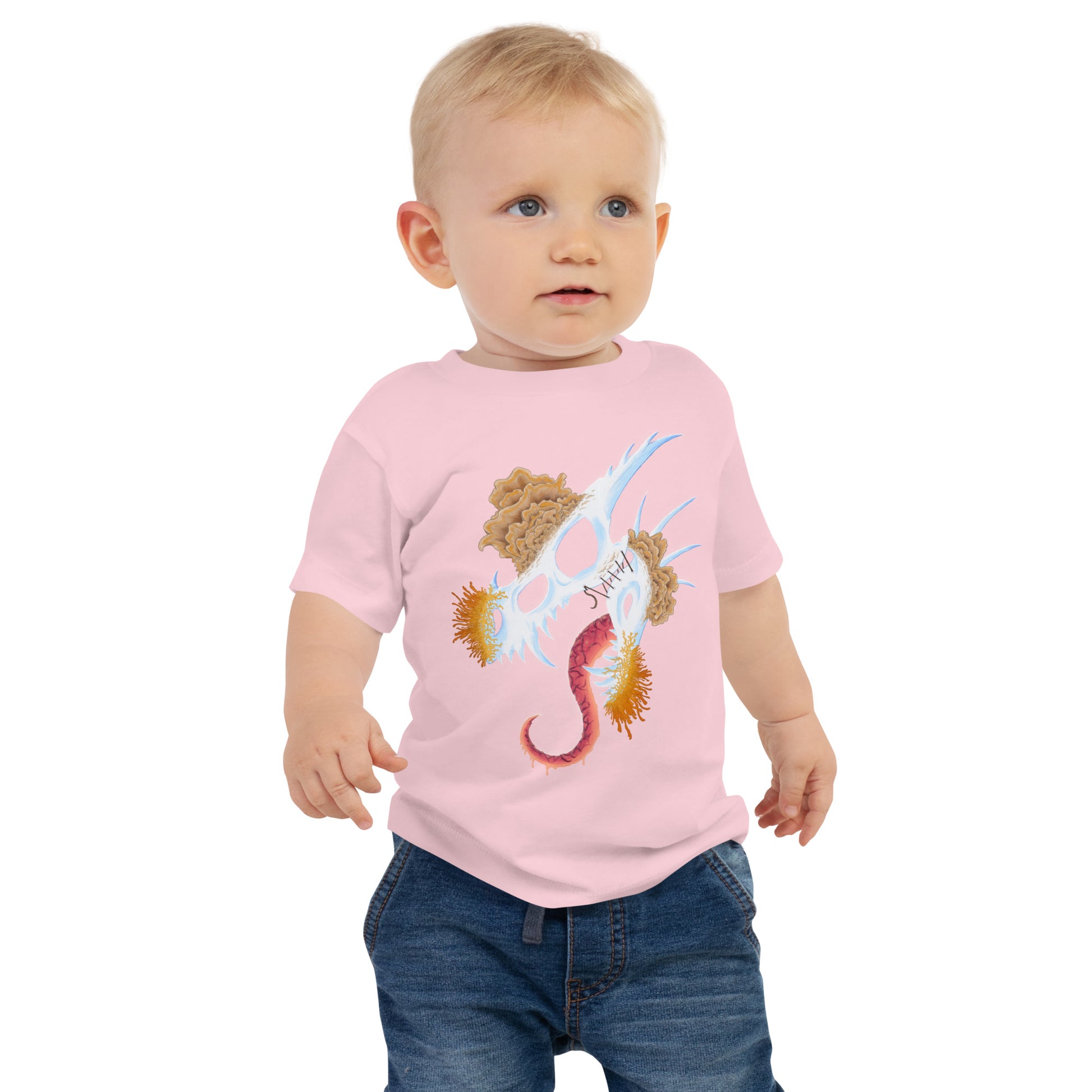 dragon skull with three different types of mushrooms growing from it on a baby staple tee pink color