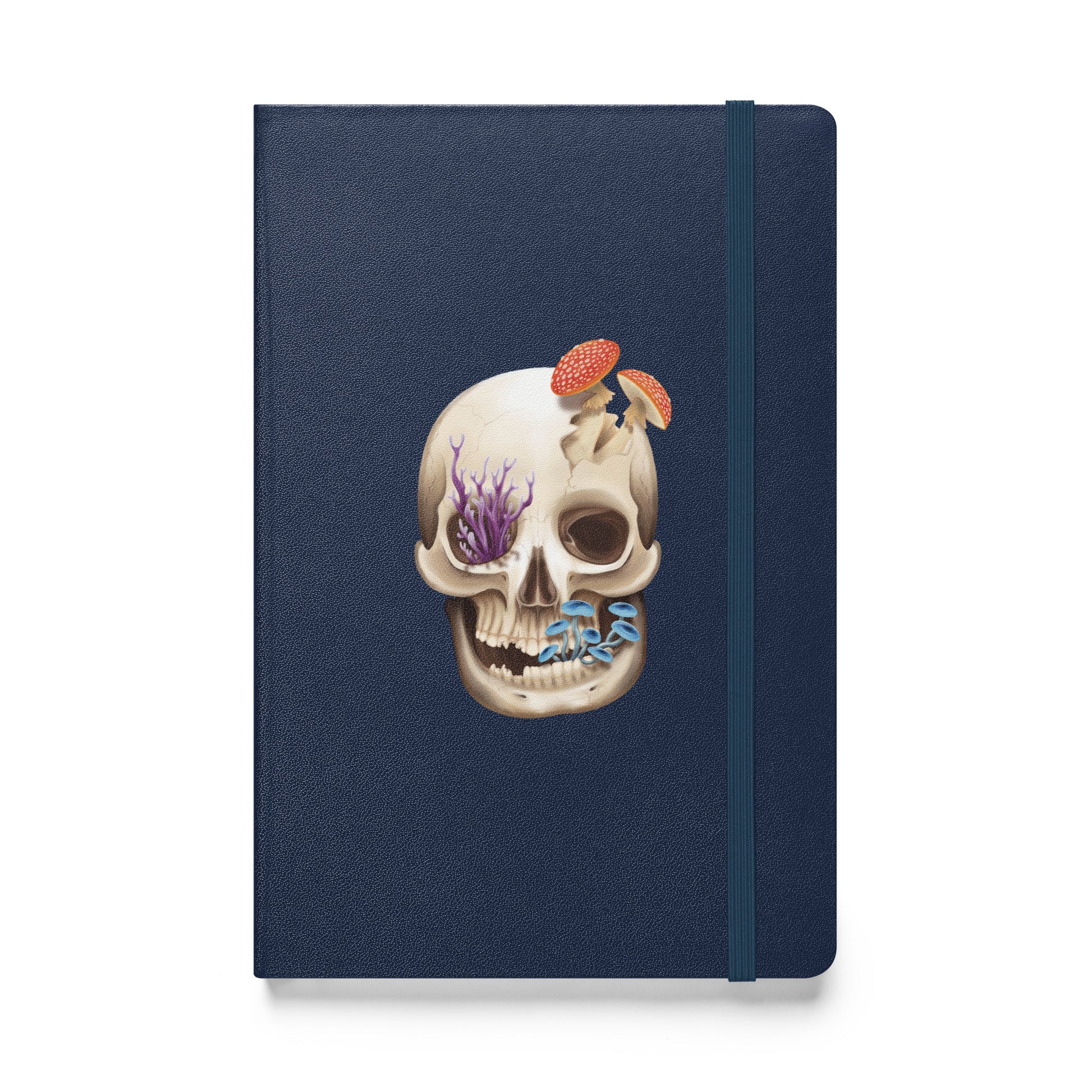 A navy blue notebook with an elastic closure, 80 lined pages, a ribbon bookmark, and pocket in the back that features a human skull with various fungi growing out of it on the front cover