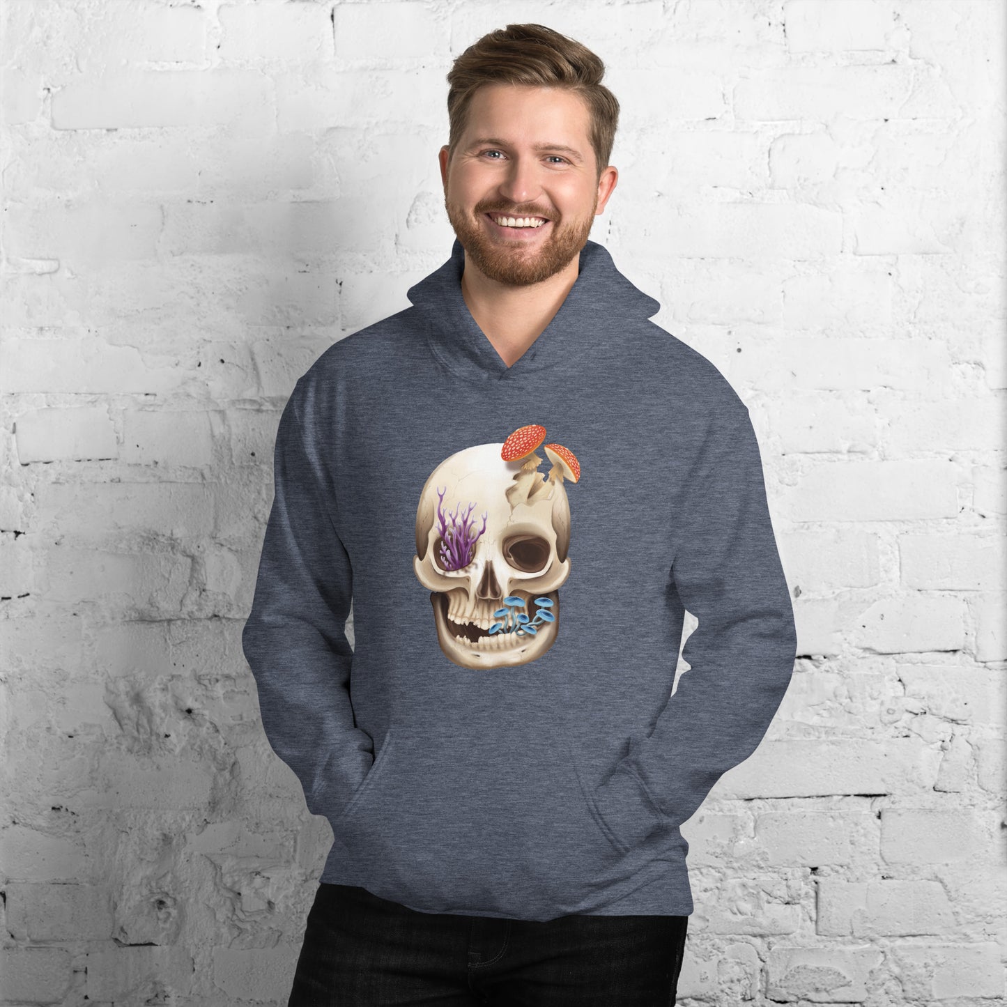 A heather blue adult hoodie with a front hand pocket featuring a front facing human skull with 3 different kinds of fungi growing out of it