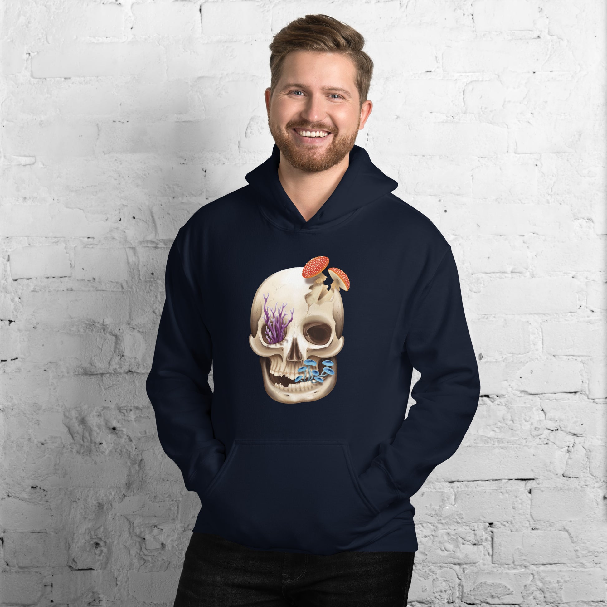 A navy blue adult hoodie with a front hand pocket featuring a front facing human skull with 3 different kinds of fungi growing out of it