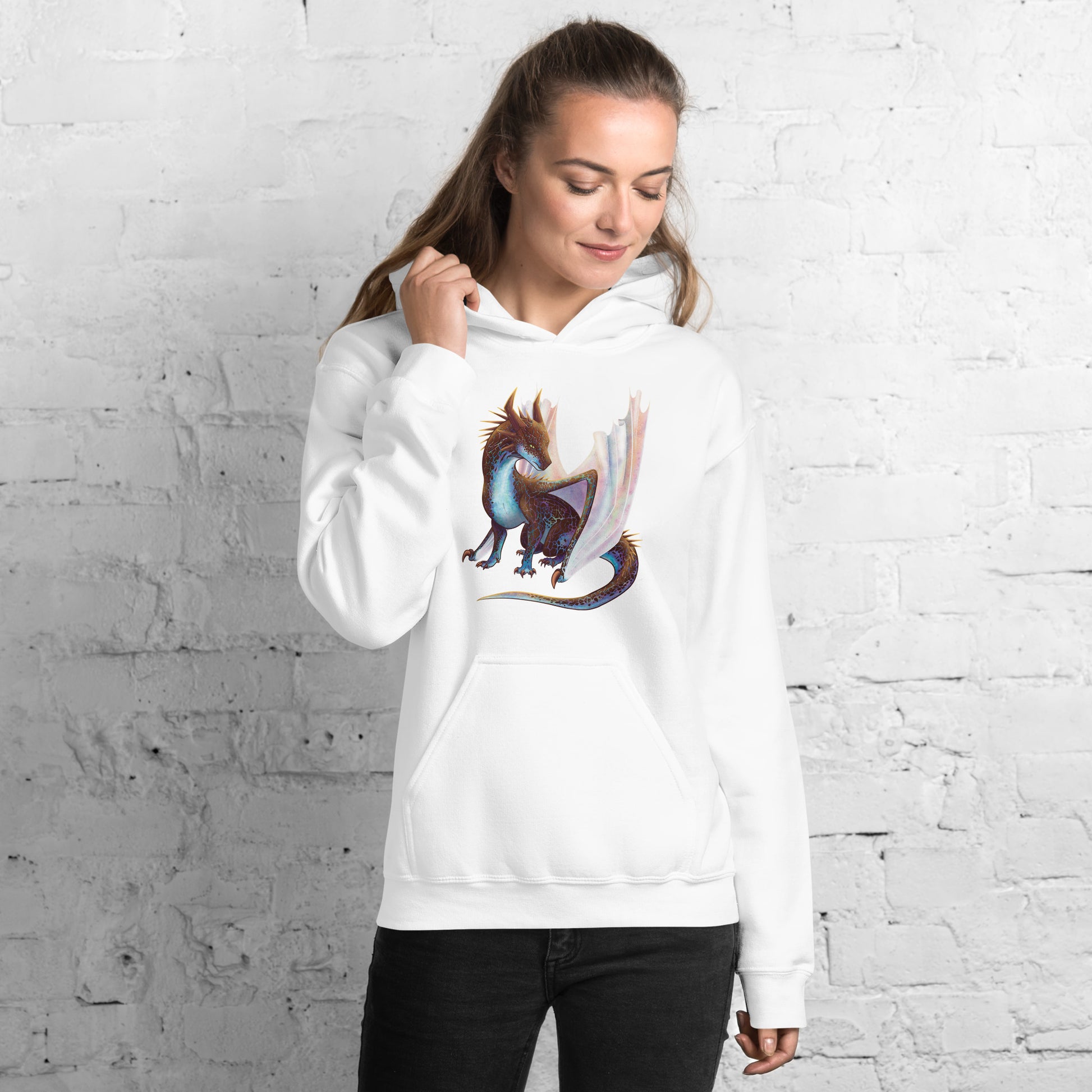 Unisex, white in color adult hoodie with a pocket in front featuring a sitting, side profile of a dragon that has the features of a boulder opal with hues of blue, green, purple, and pink on the underbelly and cracks of the rough, brown hue, rock scales. The wings are tucked back and are of an iridescent shimmery hue