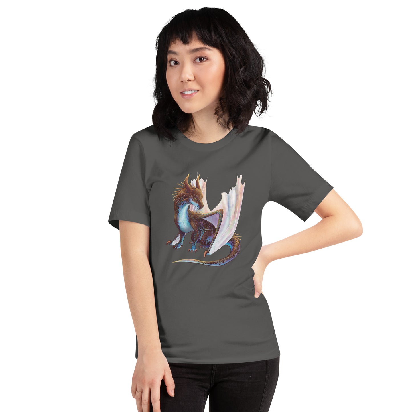 Unisex, dark grey in color adult short sleeve tee shirt featuring a sitting, side profile of a dragon that has the features of a boulder opal with hues of blue, green, purple, and pink on the underbelly and cracks of the rough, brown hue, rock scales. The wings are tucked back and are of an iridescent shimmery hue