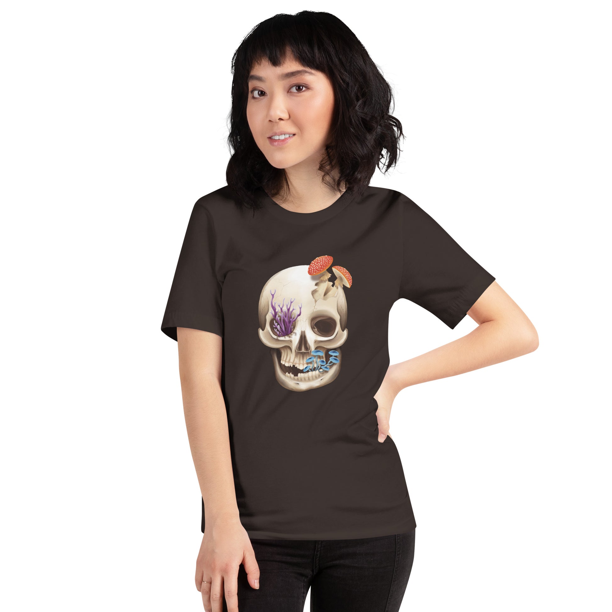 A unisex, brown, adult short sleeve T shirt featuring a front facing human skull with 3 different kinds of fungi growing out of it