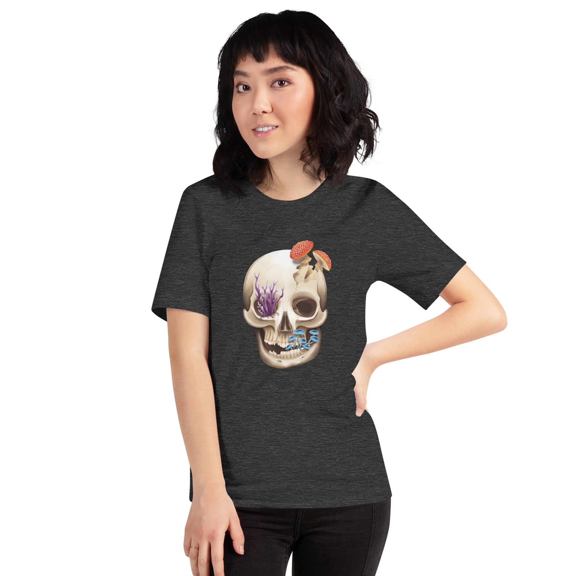 A unisex, dark heather grey, adult short sleeve T shirt featuring a front facing human skull with 3 different kinds of fungi growing out of it