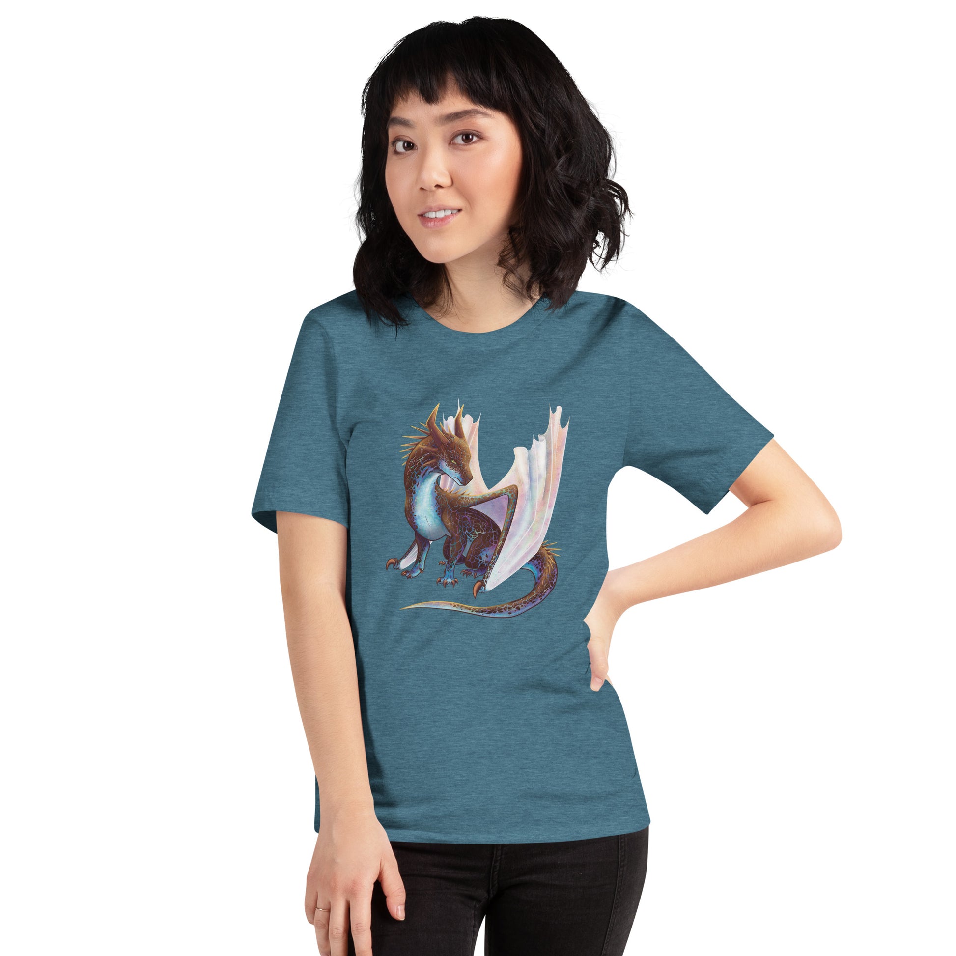 Unisex, heather teal in color adult short sleeve tee shirt featuring a sitting, side profile of a dragon that has the features of a boulder opal with hues of blue, green, purple, and pink on the underbelly and cracks of the rough, brown hue, rock scales. The wings are tucked back and are of an iridescent shimmery hue