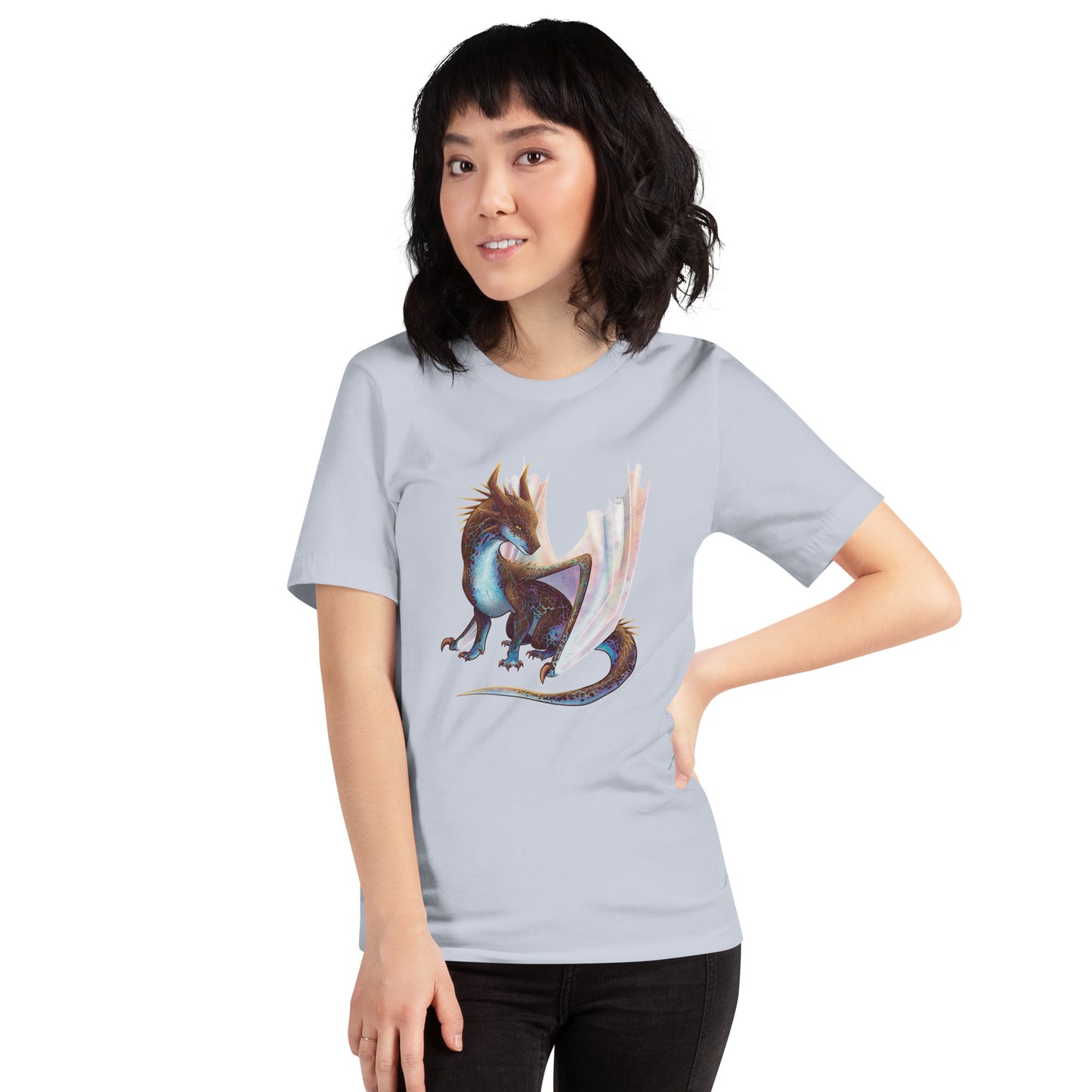 Unisex, light blue in color adult short sleeve tee shirt featuring a sitting, side profile of a dragon that has the features of a boulder opal with hues of blue, green, purple, and pink on the underbelly and cracks of the rough, brown hue, rock scales. The wings are tucked back and are of an iridescent shimmery hue