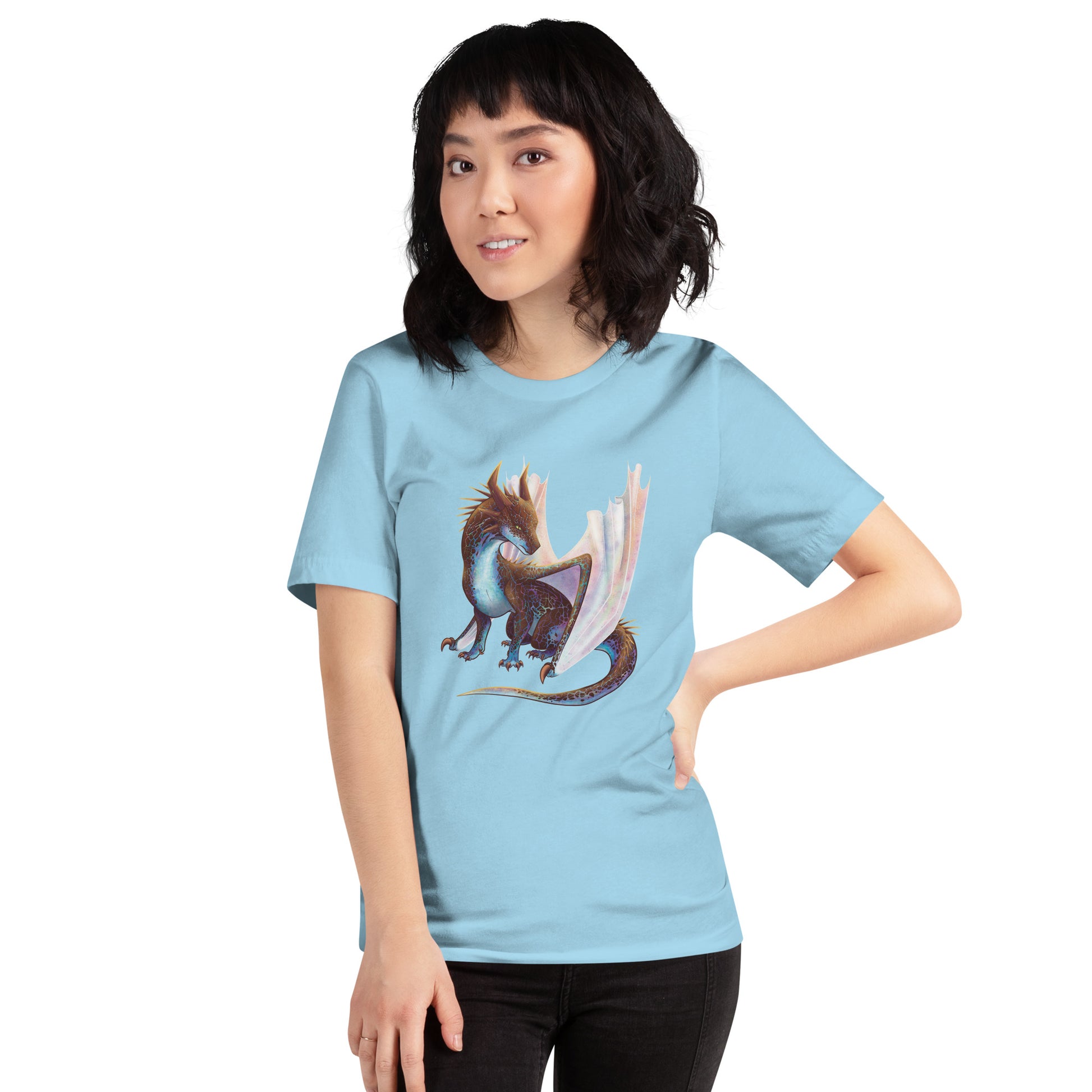 Unisex, ocean blue in color adult short sleeve tee shirt featuring a sitting, side profile of a dragon that has the features of a boulder opal with hues of blue, green, purple, and pink on the underbelly and cracks of the rough, brown hue, rock scales. The wings are tucked back and are of an iridescent shimmery hue