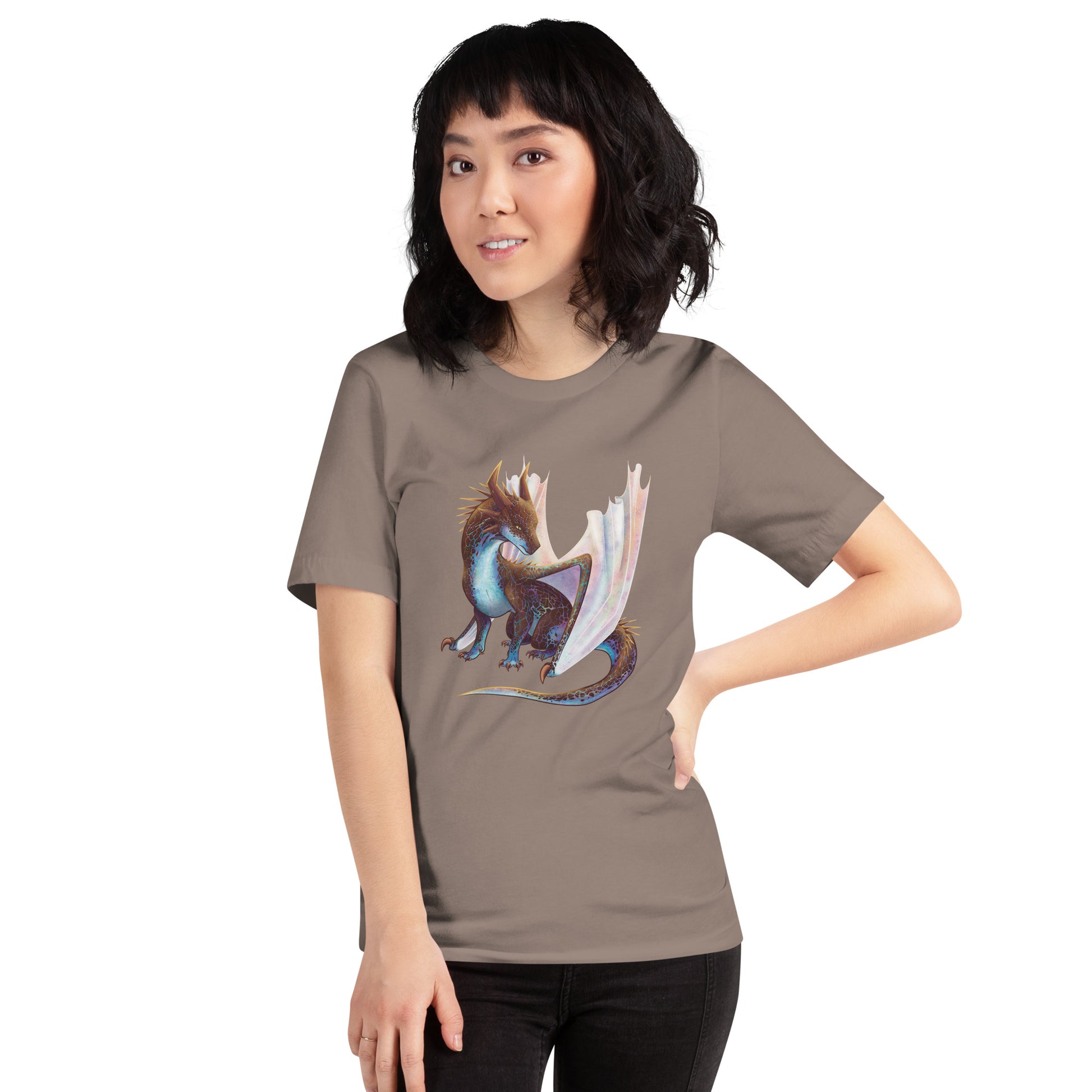 Unisex, dark tan in color adult short sleeve tee shirt featuring a sitting, side profile of a dragon that has the features of a boulder opal with hues of blue, green, purple, and pink on the underbelly and cracks of the rough, brown hue, rock scales. The wings are tucked back and are of an iridescent shimmery hue