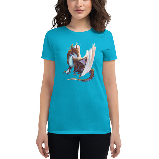 Unisex, turquoise in color, adult women's short sleeve tee shirt featuring a sitting, side profile of a dragon that has the features of a boulder opal with hues of blue, green, purple, and pink on the underbelly and cracks of the rough, brown hue, rock scales. The wings are tucked back and are of an iridescent shimmery hue