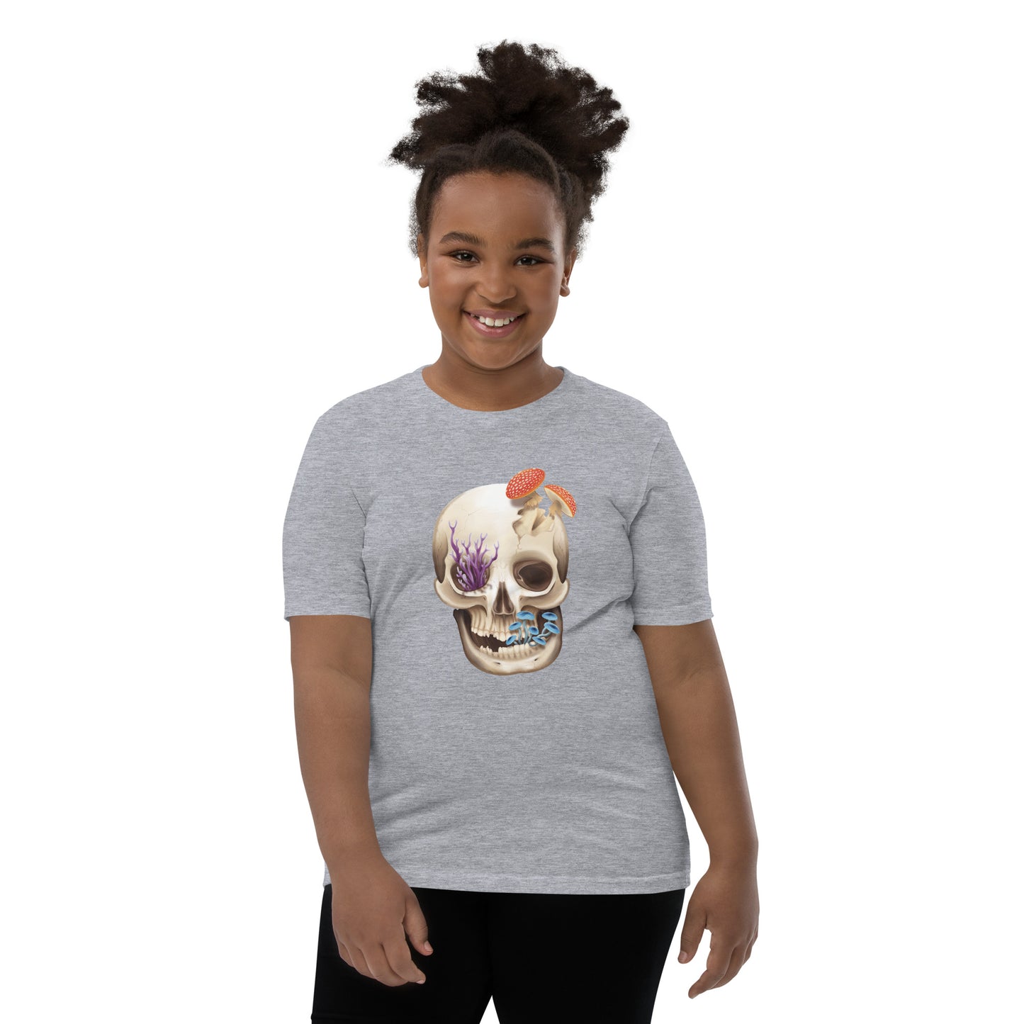 A unisex youth sized, light heather grey in color, short sleeve t shirt featuring a human skull with various kinds of fungi growing out of it