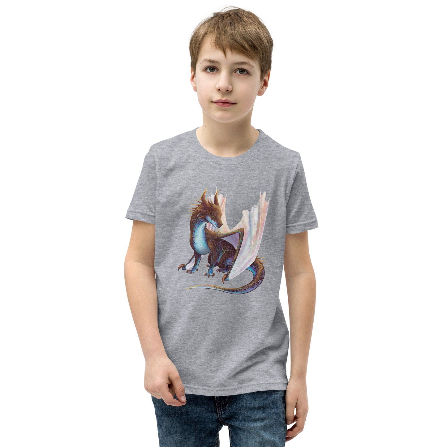 Unisex, heather grey in color youth short sleeve tee shirt featuring a sitting, side profile of a dragon that has the features of a boulder opal with hues of blue, green, purple, and pink on the underbelly and cracks of the rough, brown hue, rock scales. The wings are tucked back and are of an iridescent shimmery hue