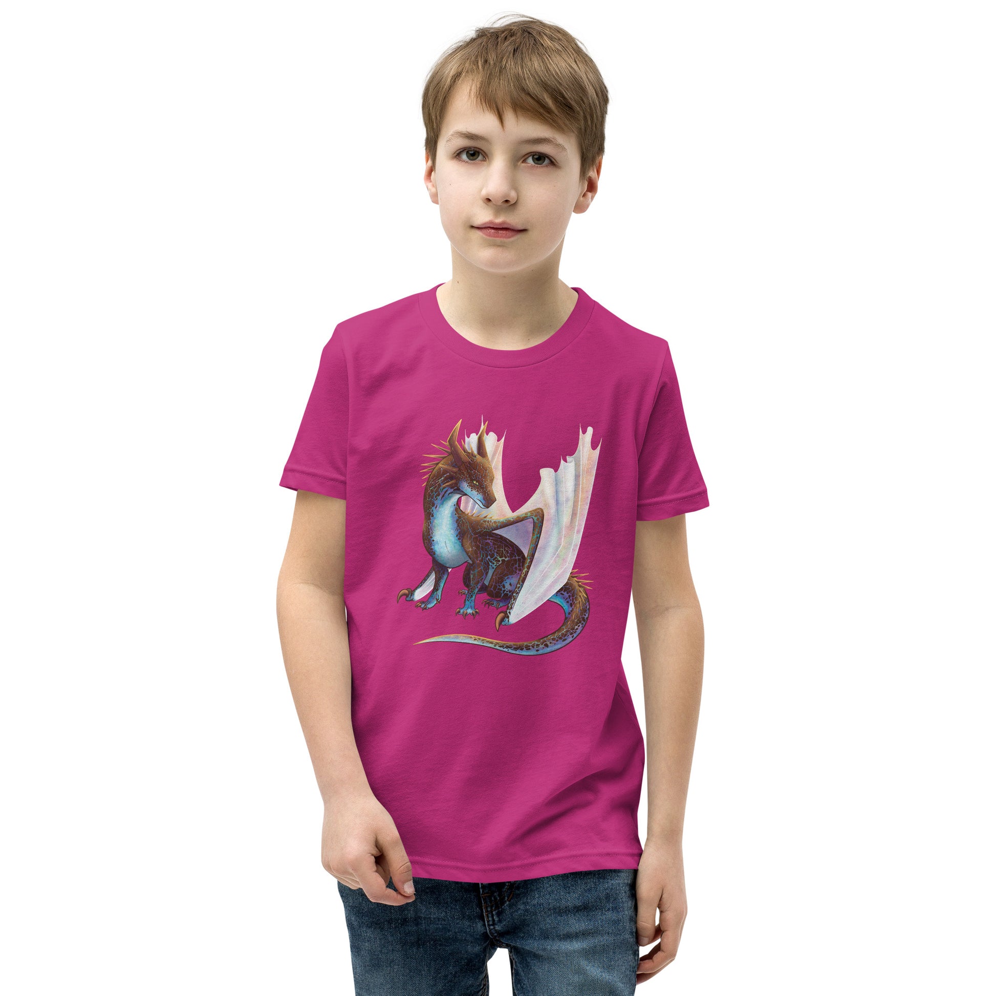 Unisex, berry pink in color youth short sleeve tee shirt featuring a sitting, side profile of a dragon that has the features of a boulder opal with hues of blue, green, purple, and pink on the underbelly and cracks of the rough, brown hue, rock scales. The wings are tucked back and are of an iridescent shimmery hue