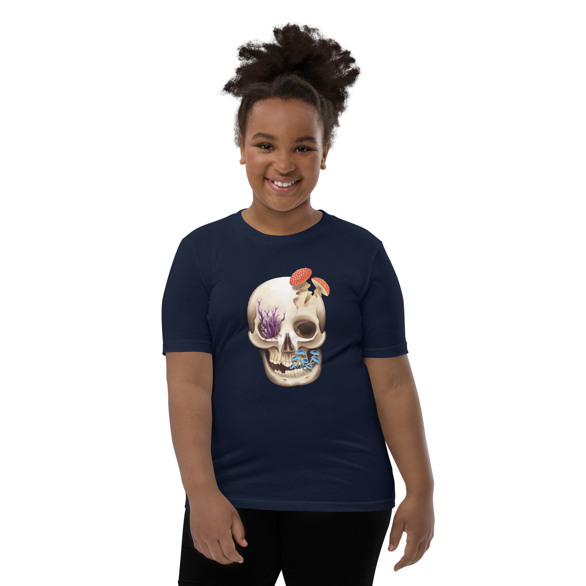 A unisex youth sized, navy blue in color, short sleeve t shirt featuring a human skull with various kinds of fungi growing out of it