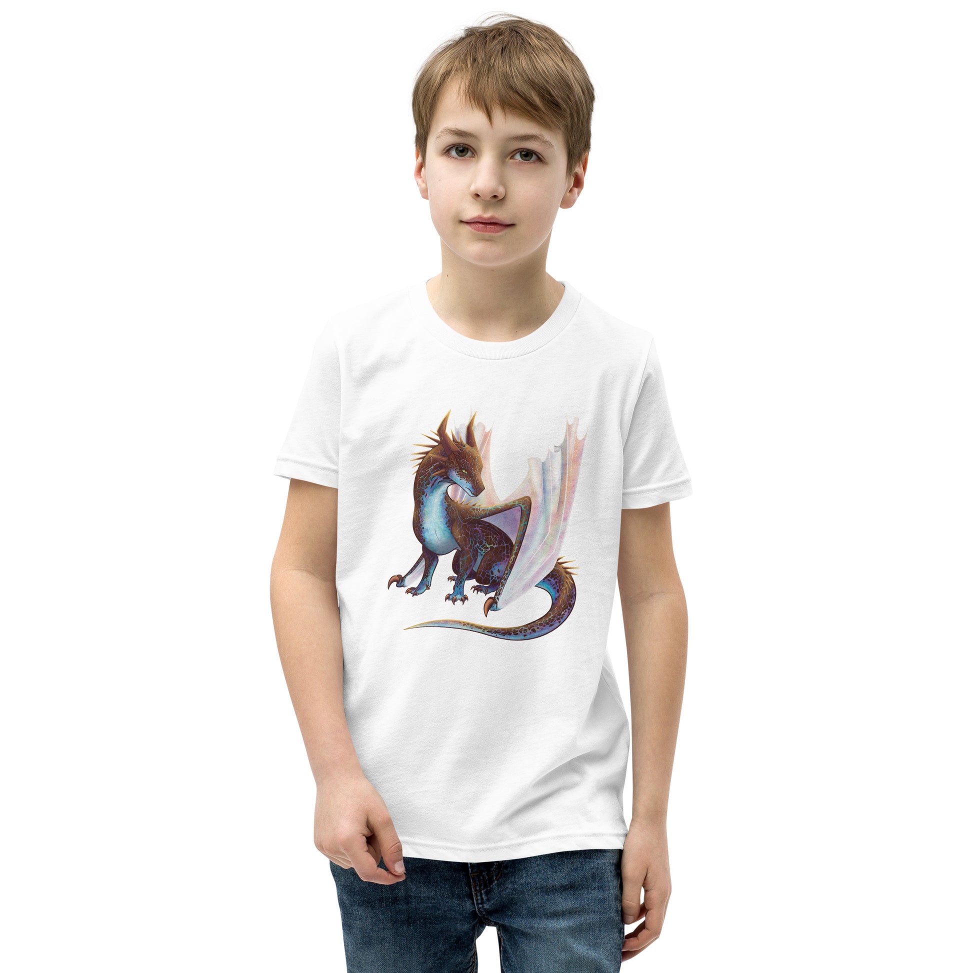 Unisex, white in color youth short sleeve tee shirt featuring a sitting, side profile of a dragon that has the features of a boulder opal with hues of blue, green, purple, and pink on the underbelly and cracks of the rough, brown hue, rock scales. The wings are tucked back and are of an iridescent shimmery hue